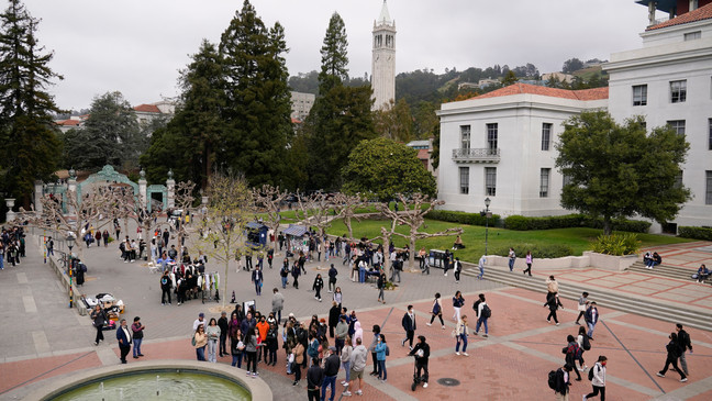 FILE - Students make their way through Sproul Plaza on the University of California, Berkeley, campus Tuesday, March 29, 2022, in Berkeley, Calif. (AP Photo/Eric Risberg, File)