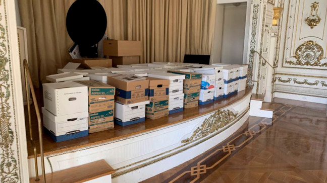 This image, contained in the indictment against former President Donald Trump, shows boxes of records being stored on the stage in the White and Gold Ballroom at Trump's Mar-a-Lago estate in Palm Beach, Fla. (Justice Department via AP)