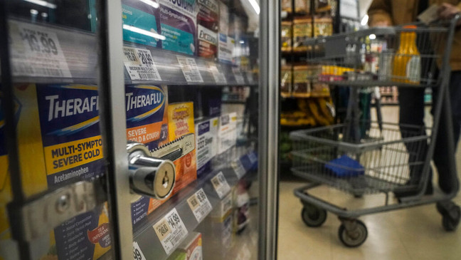 Pharmaceutical items are kept locked in a glass cabinet at a Gristedes supermarket, Tuesday Jan. 31, 2023, in New York. (AP Photo/Bebeto Matthews)