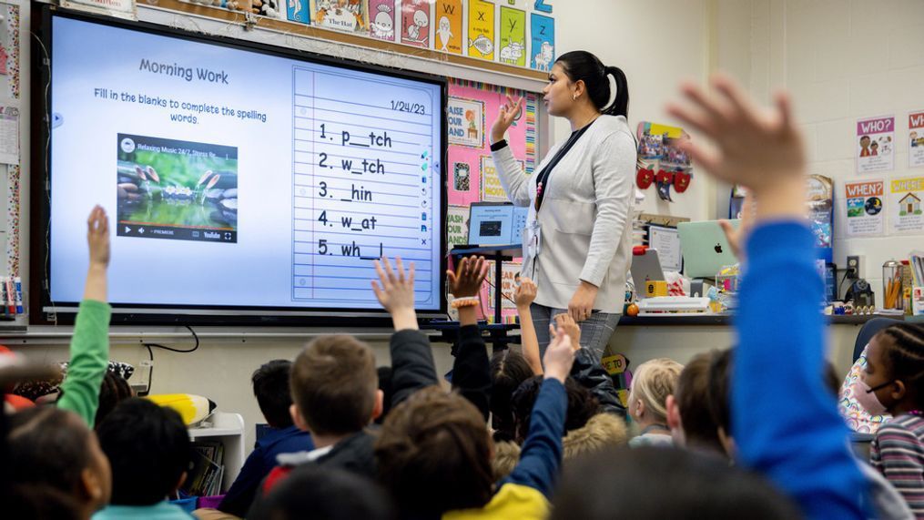 Christine Ramroop teaches first graders during their warm-up for the day at Whitehall Elementary School, Tuesday, Jan. 24, 2023, in Bowie, Md. (AP Photo/Julia Nikhinson)